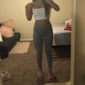 Gray leggings with cross detailing on the back